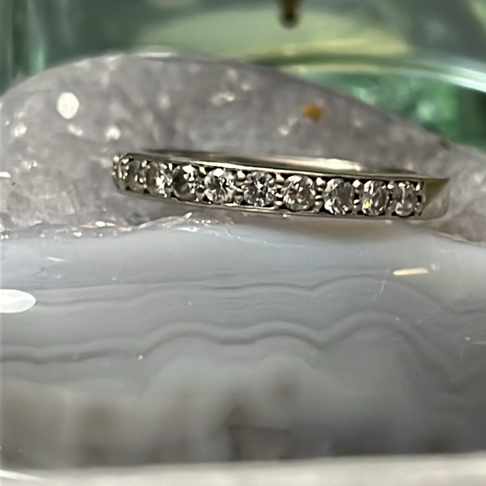 14K White Gold Wedding Band with diamonds extending half of the way.